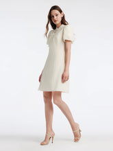 a woman in white short dress